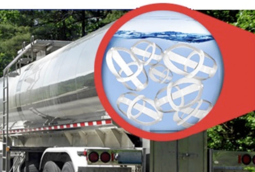 Tank trailer with a magnified callout showing several Surge Busters floating freely inside the liquid
